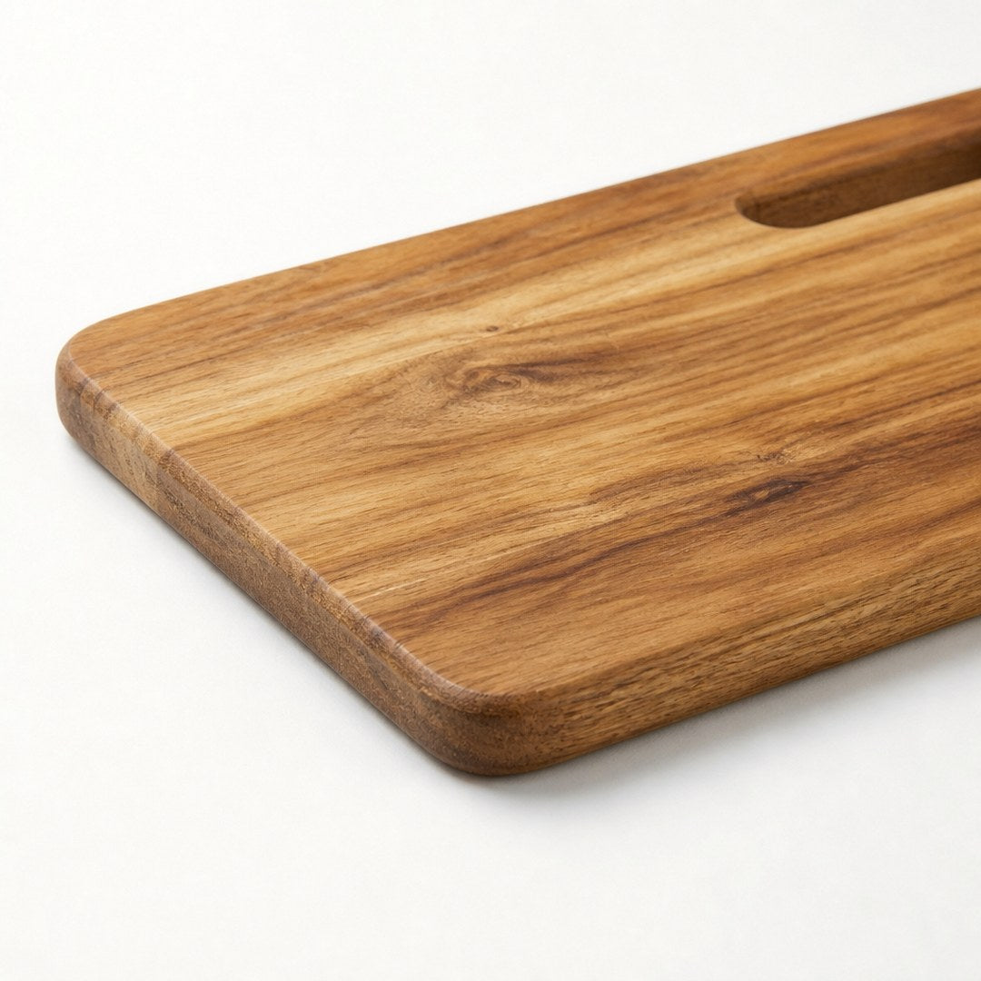 Acacia serving board corner close-up showing edge thickness and grain