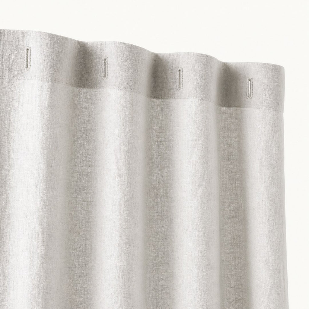 Close-up of the linen shower curtain header and buttonholes