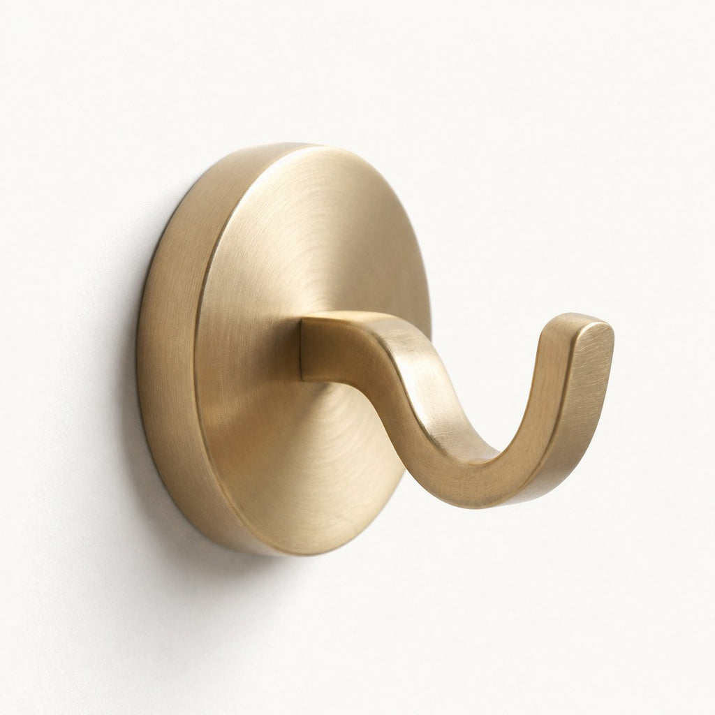 Macro of a single robe hook showing the arm curve and wall plate