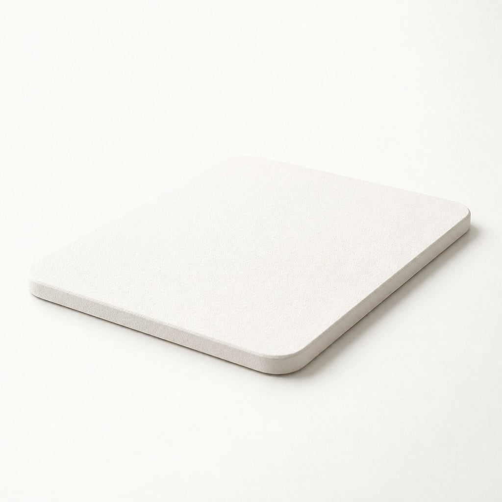 Corner detail of diatomite bath mat showing slab thickness