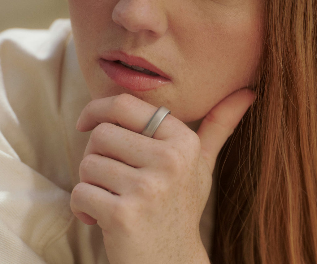 Titanium smart health ring in Brushed Silver — worn