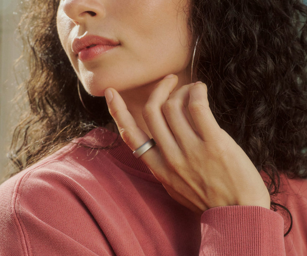 Titanium smart health ring in Brushed Silver — worn