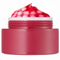 Open berry red capsule cream jar with pink capsules