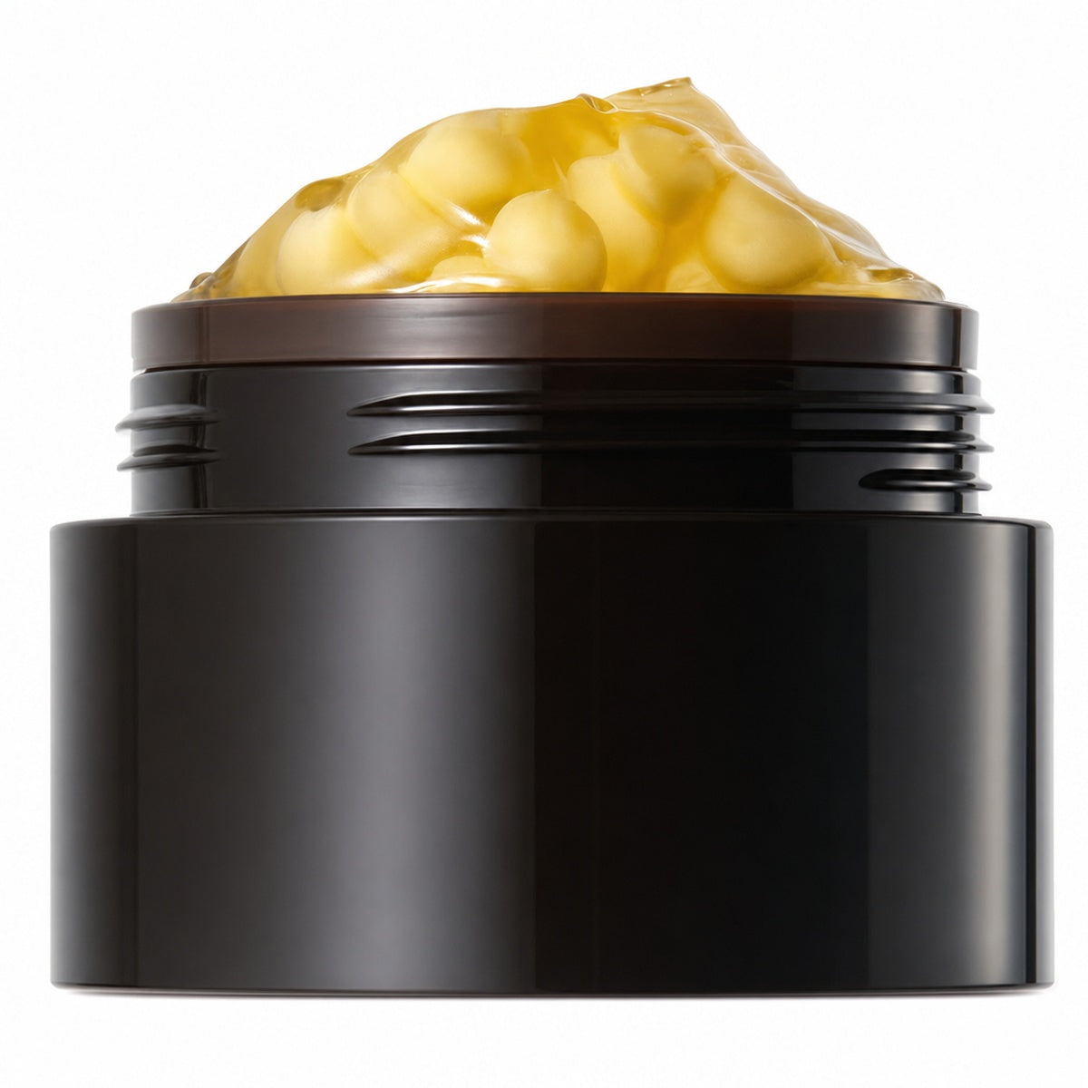 Open black capsule cream jar with yellow capsules