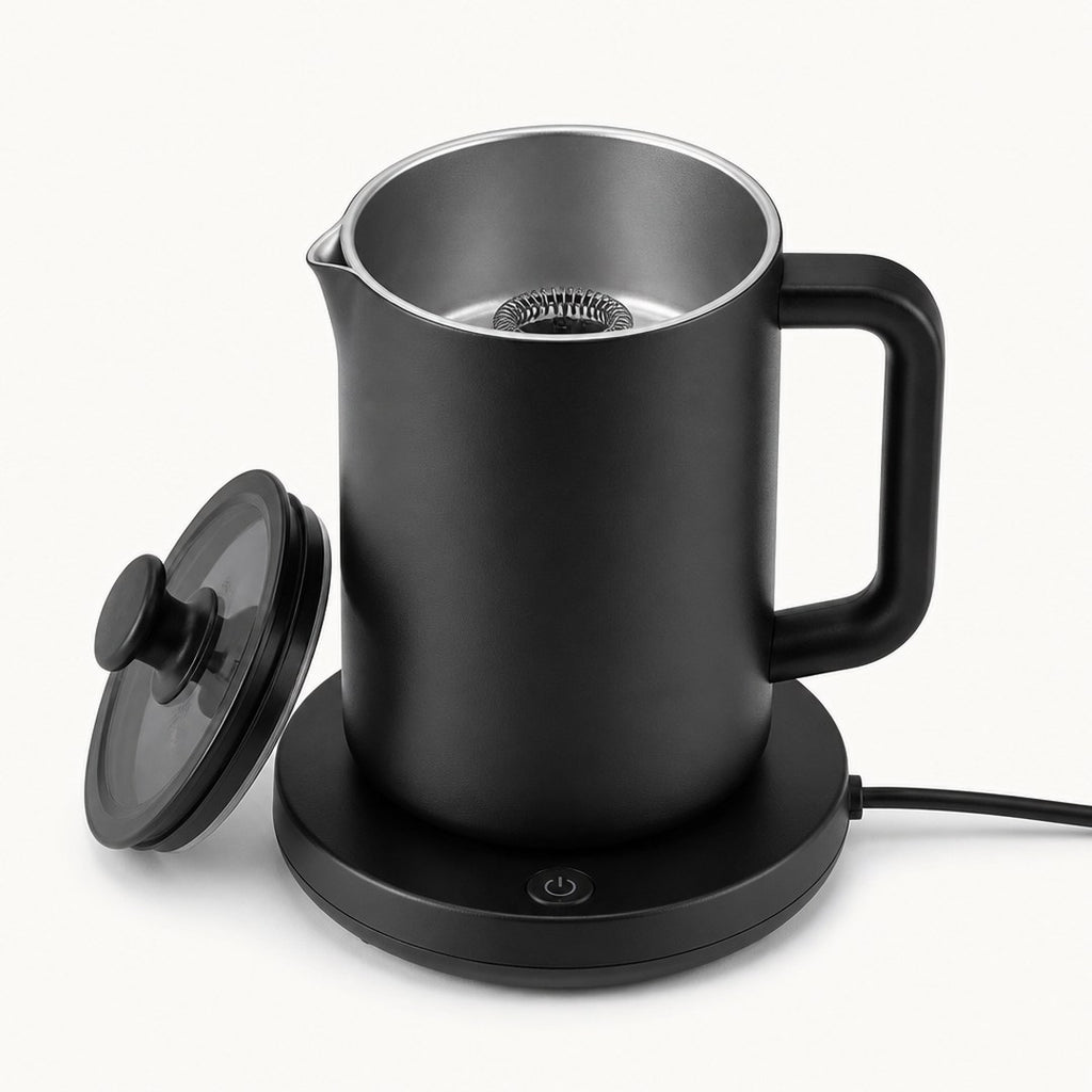 Electric milk frother with the lid off showing the whisk and inner jug