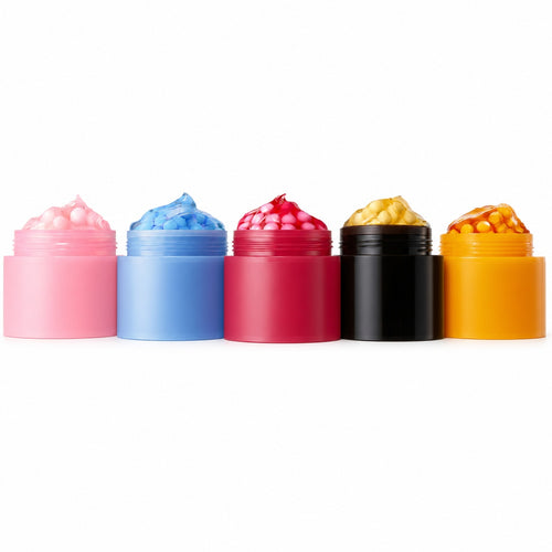 Five open capsule cream jars in pink, blue, berry, black and orange