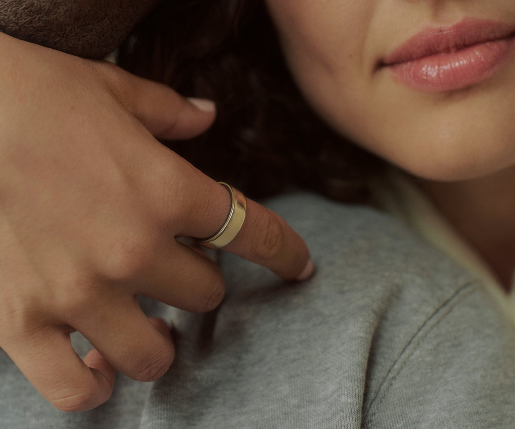 Titanium smart health ring in Gold — worn