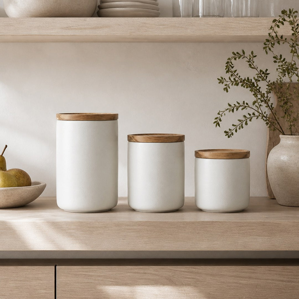 Ceramic canisters on an open kitchen shelf