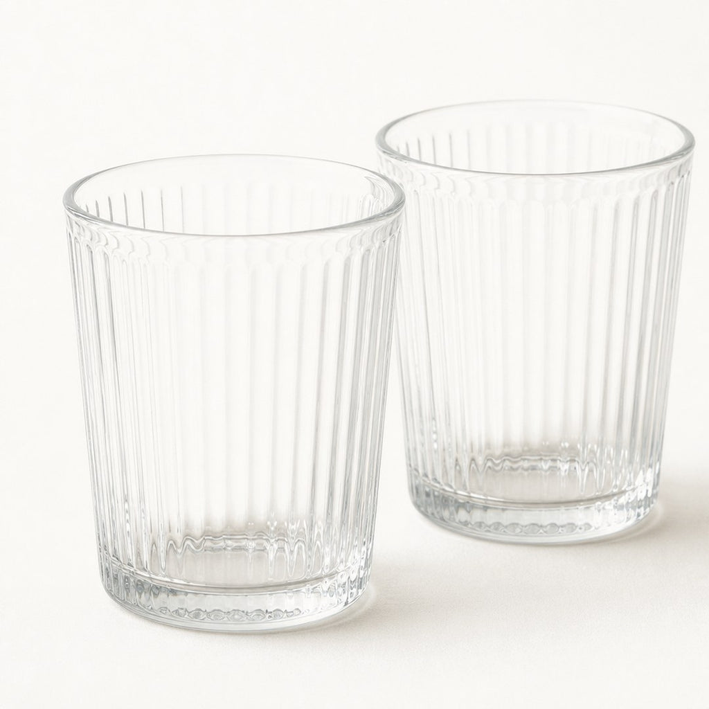 Ribbed glass tumblers close-up showing the fluted glass