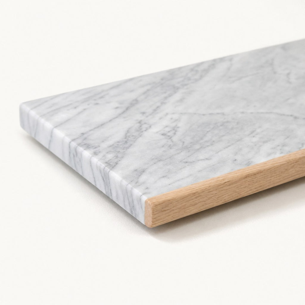 Marble pastry board corner close-up showing thickness and veining