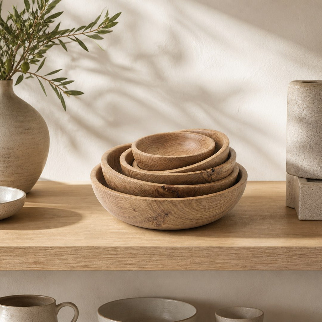 Oak serving bowls on an open kitchen shelf