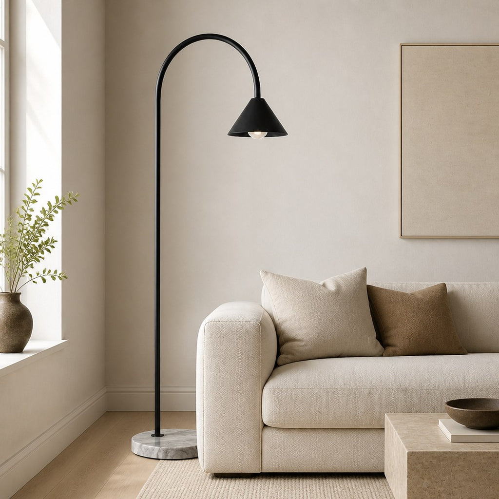 Arc Floor Lamp arcing over a linen sofa in a living room