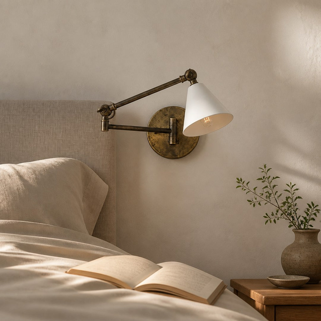 Brass Wall Sconce beside a headboard