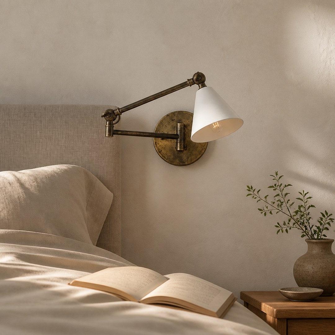 Brass Wall Sconce beside a headboard