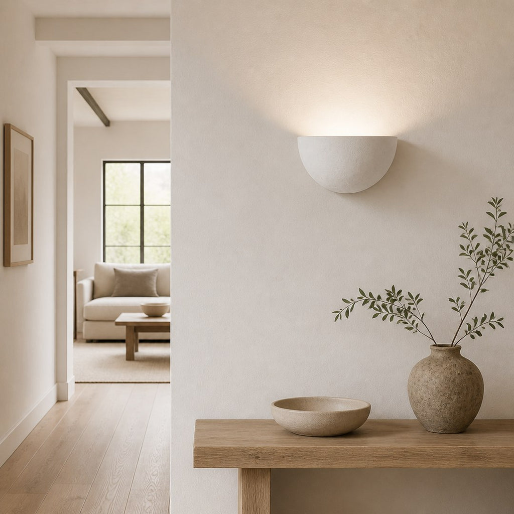 Plaster Wall Light casting an arc on a hallway wall