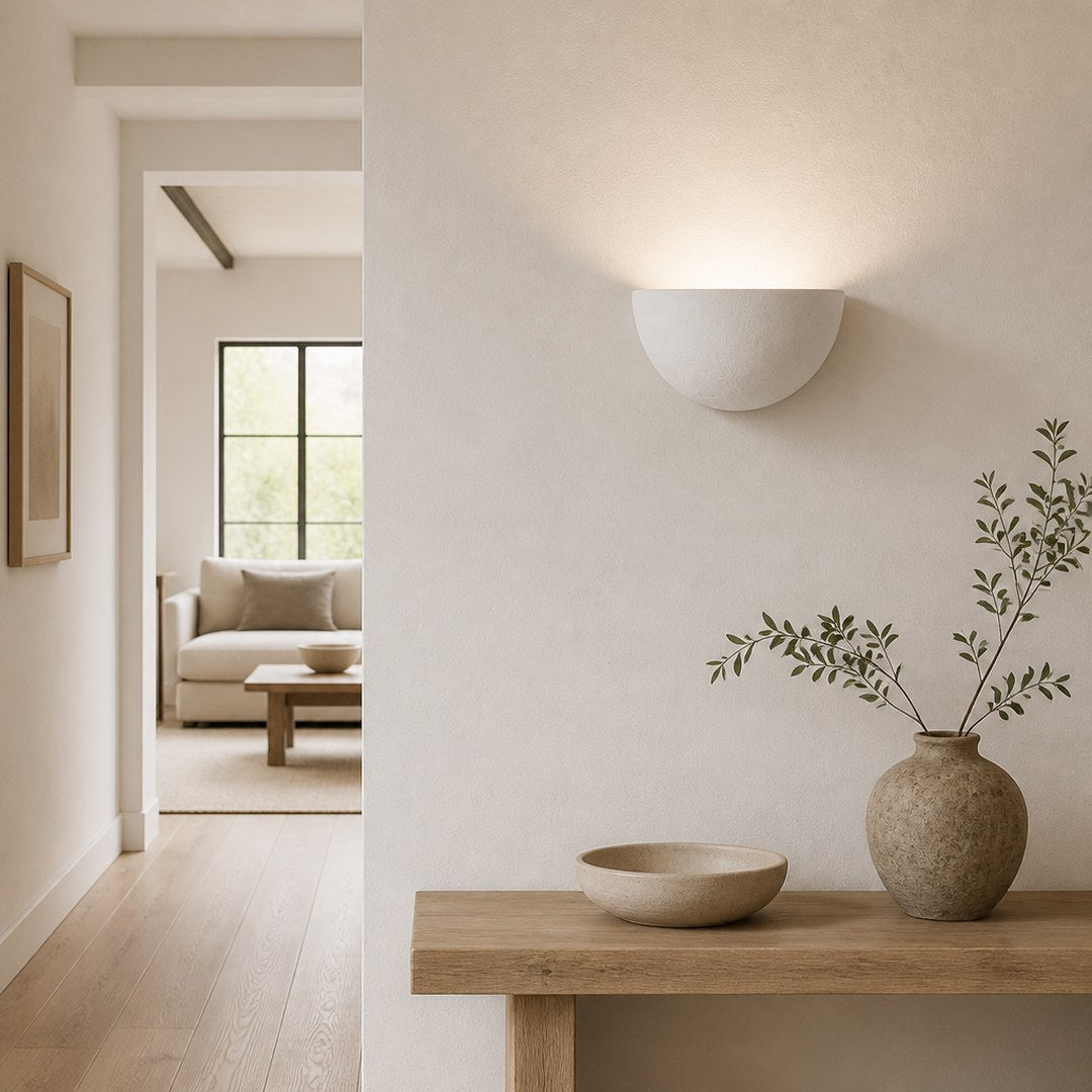Plaster Wall Light casting an arc on a hallway wall