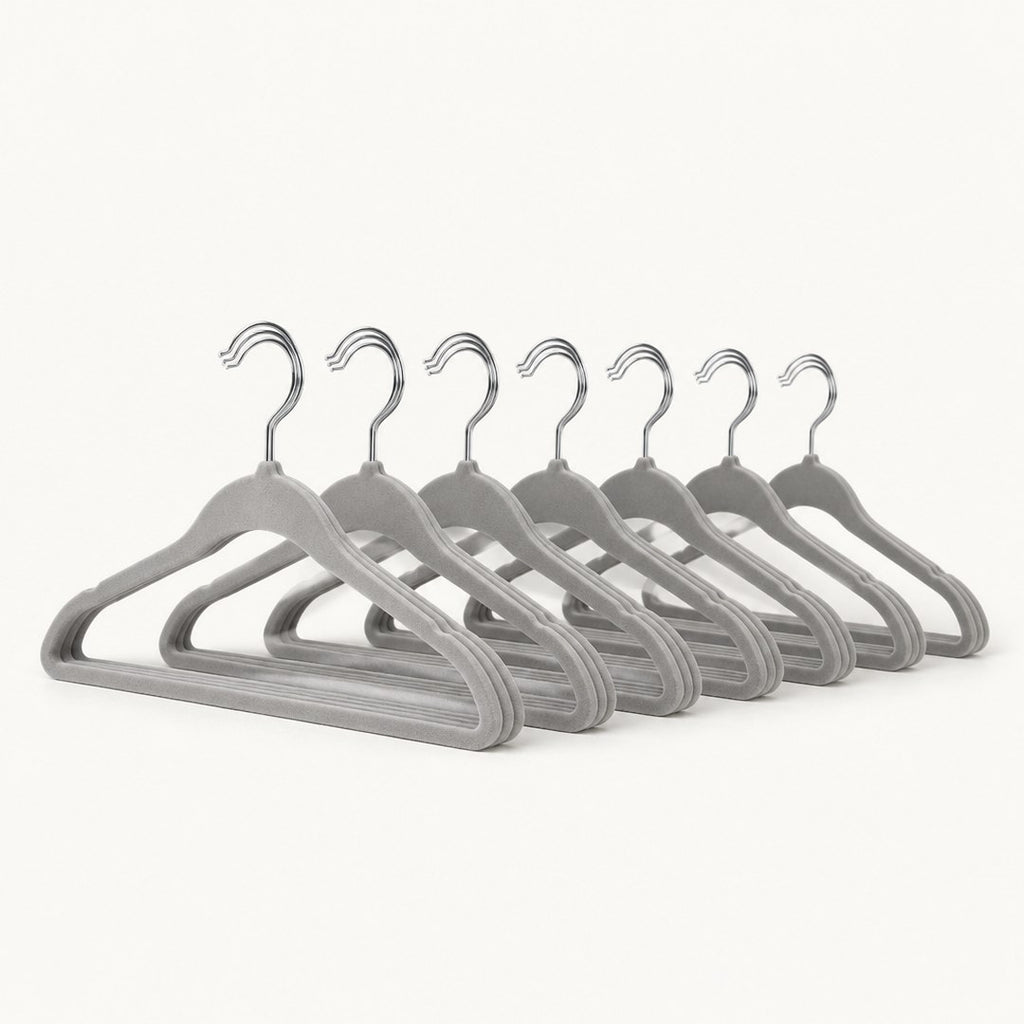 Velvet hangers fanned out separately showing the hook and shoulder profile