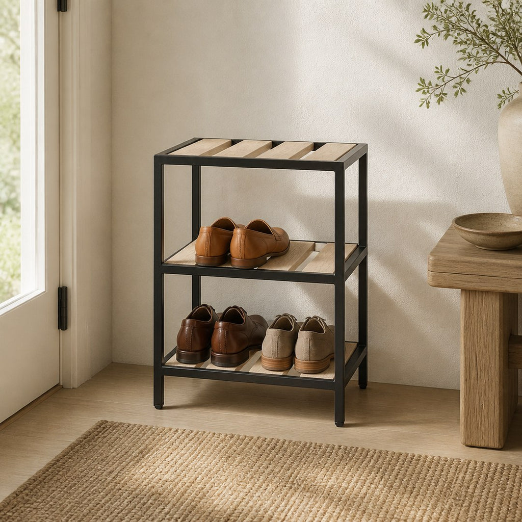 Three tier shoe rack in an entryway holding pairs of shoes