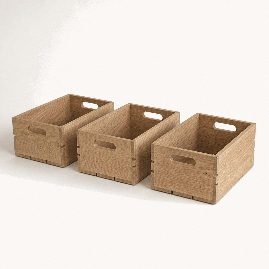 Three oak stacking crates separated side by side showing the joinery