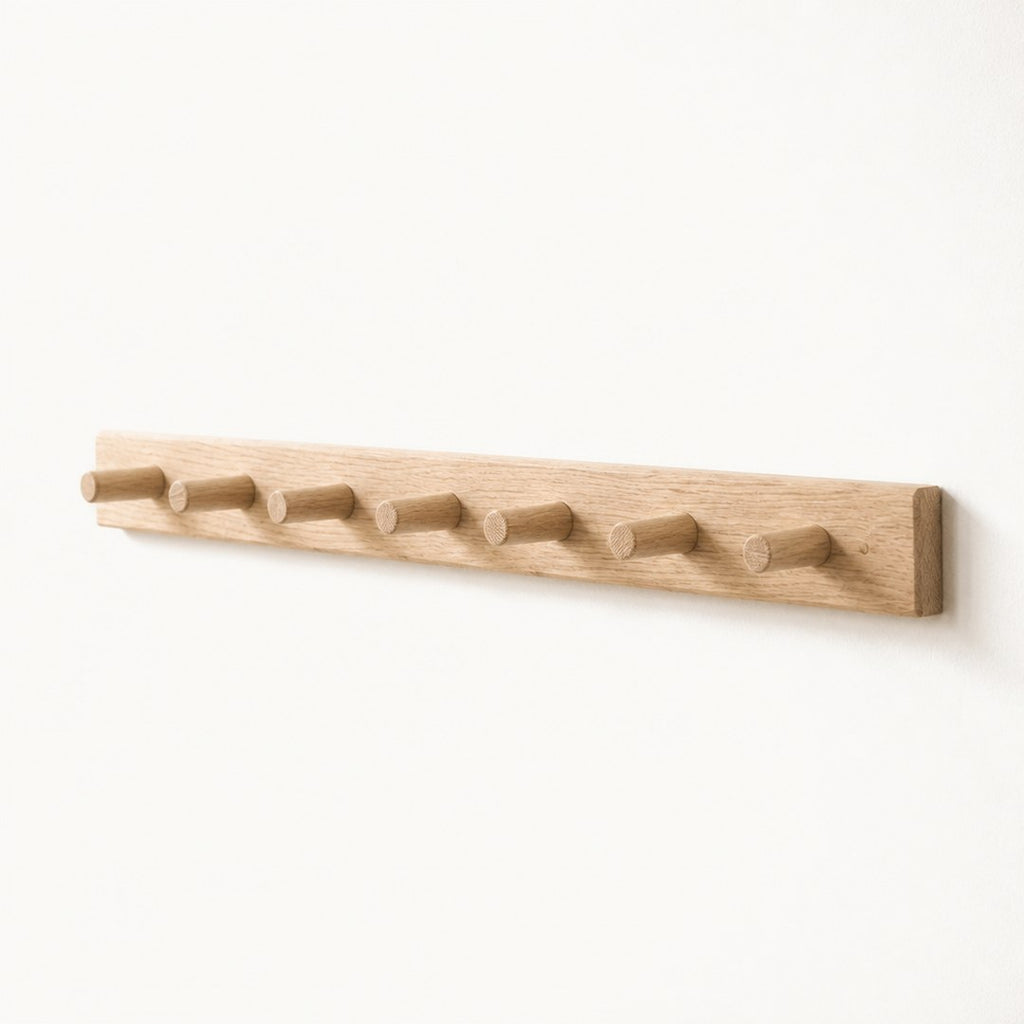 Peg rail seen along its length showing the peg projection and rail thickness