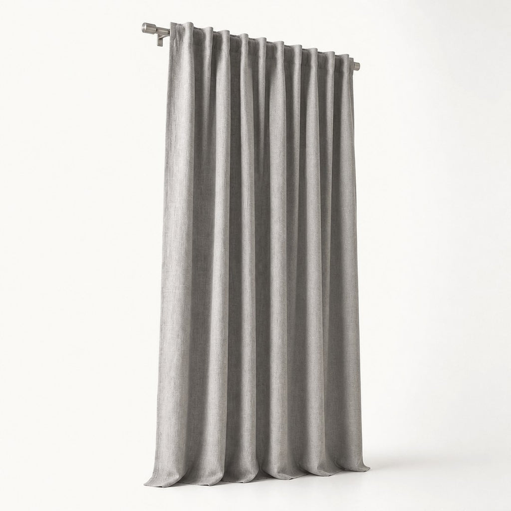 Blackout curtain panel in full drop with pleated header visible