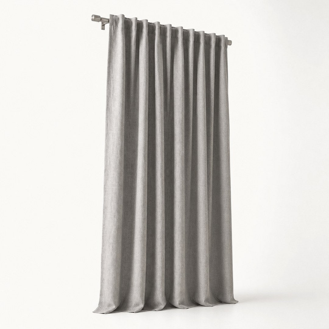 Blackout curtain panel in full drop with pleated header visible