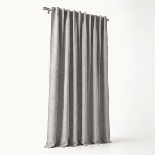Blackout curtain panel in full drop with pleated header visible