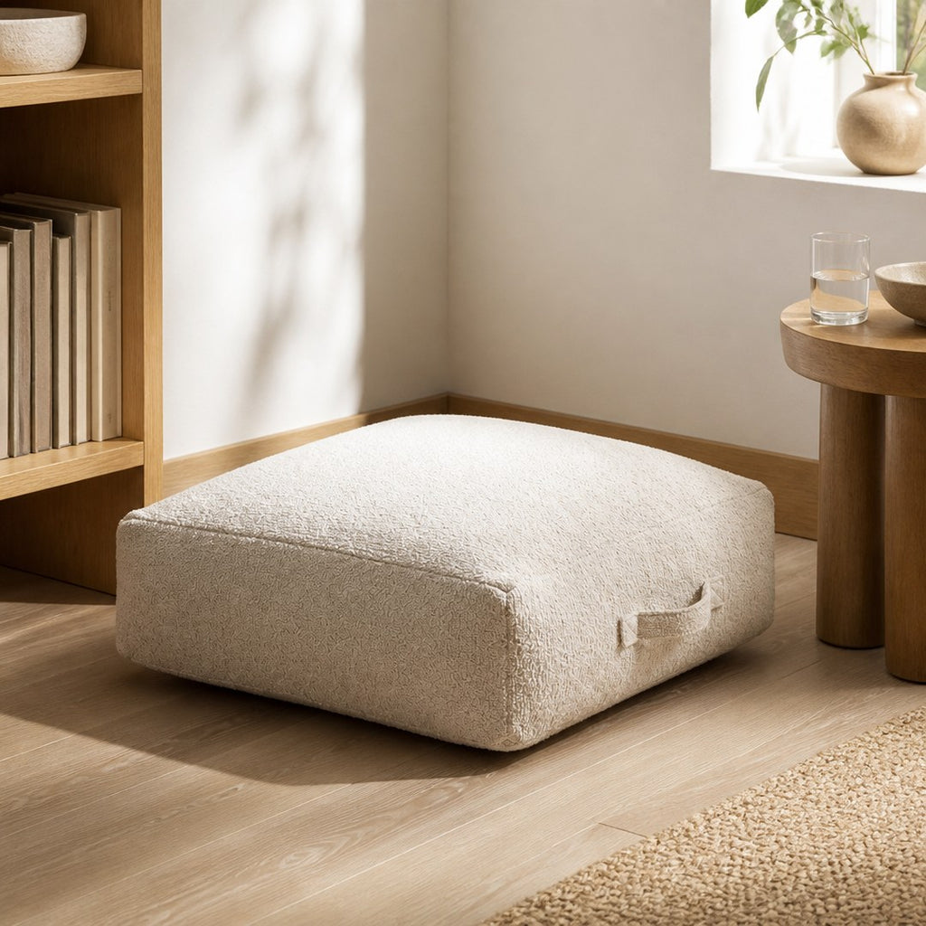 Floor cushion in a quiet reading nook corner