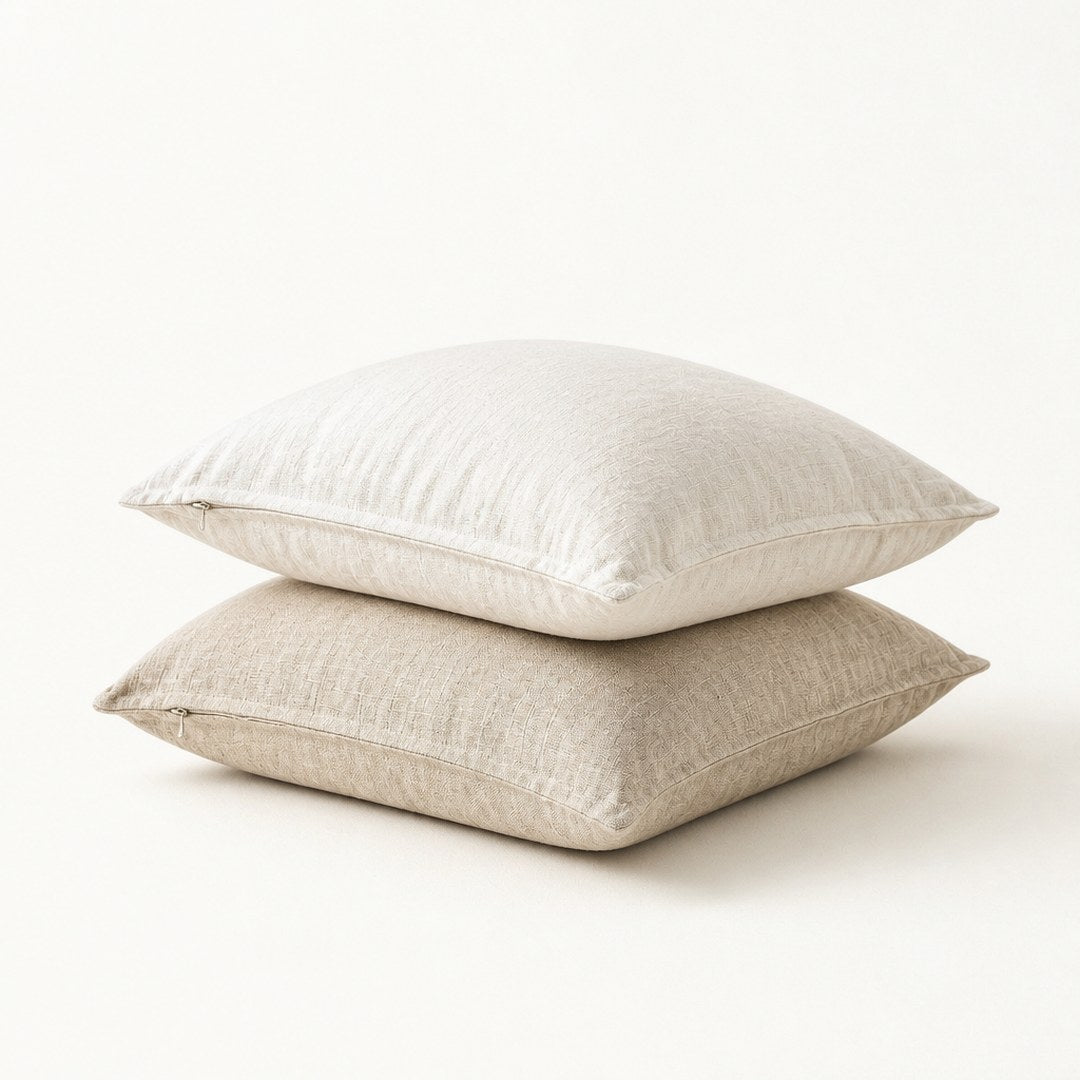 Washed linen cushions, three-quarter view showing hidden zipper and side depth
