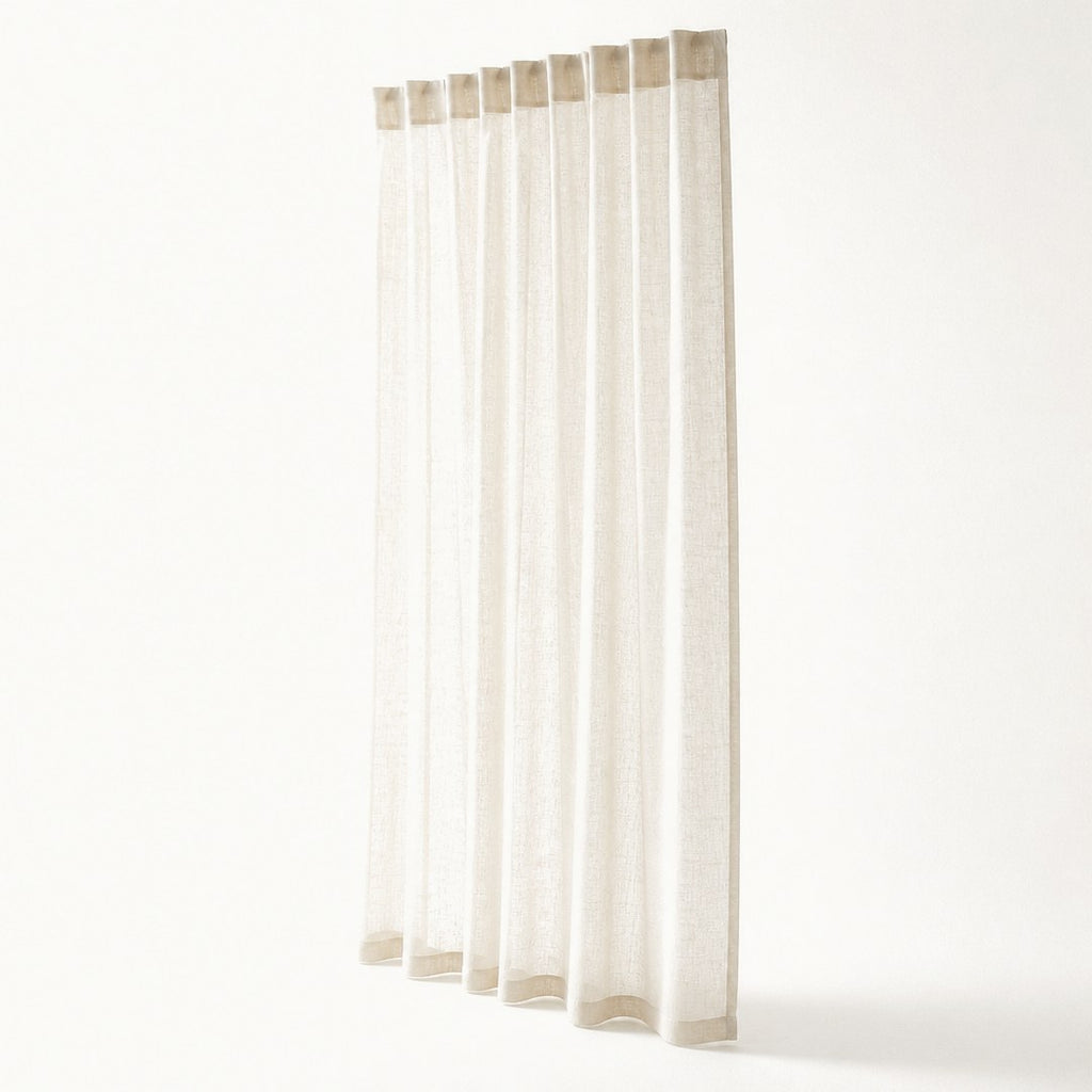 Sheer linen panel in full drop with rod-pocket header visible