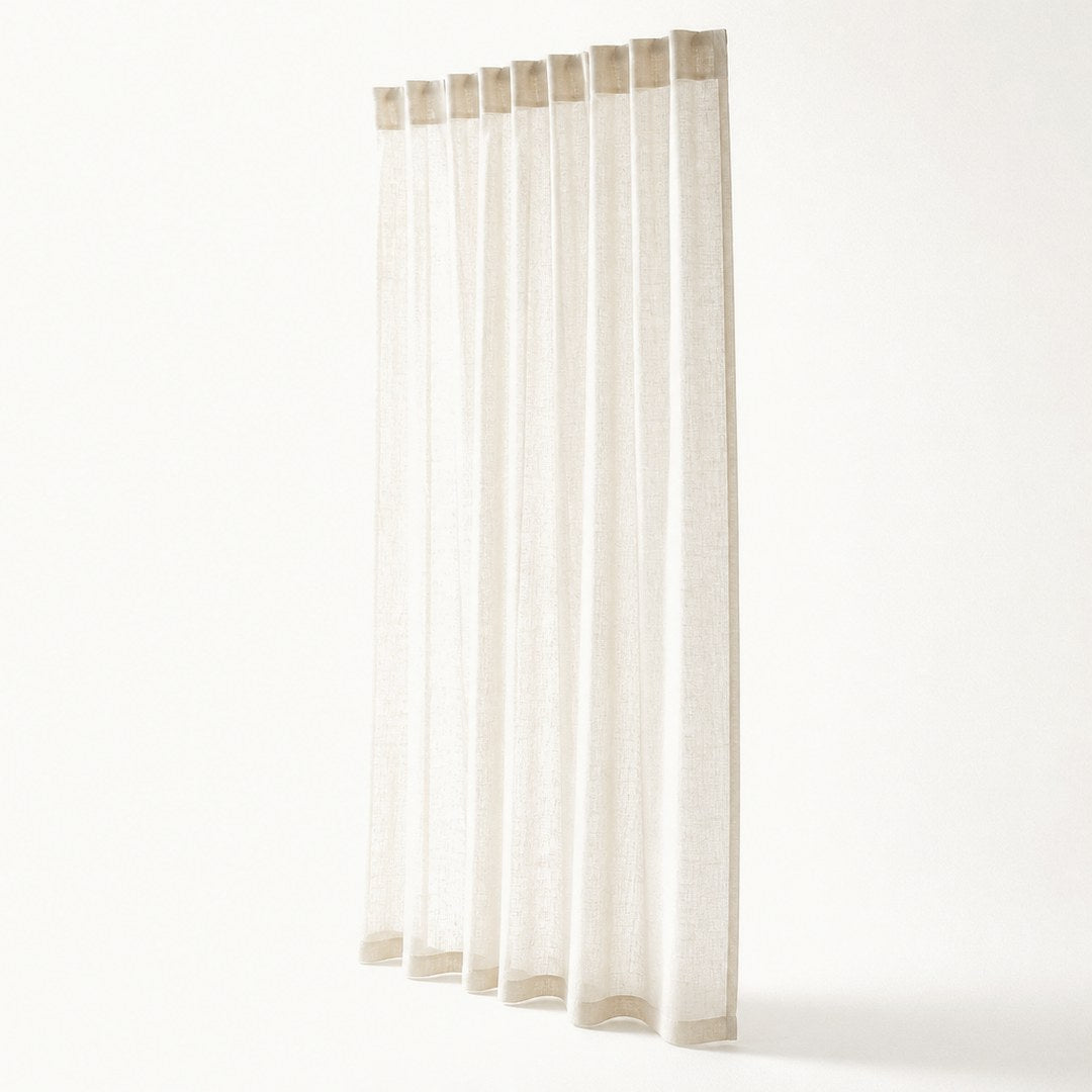 Sheer linen panel in full drop with rod-pocket header visible