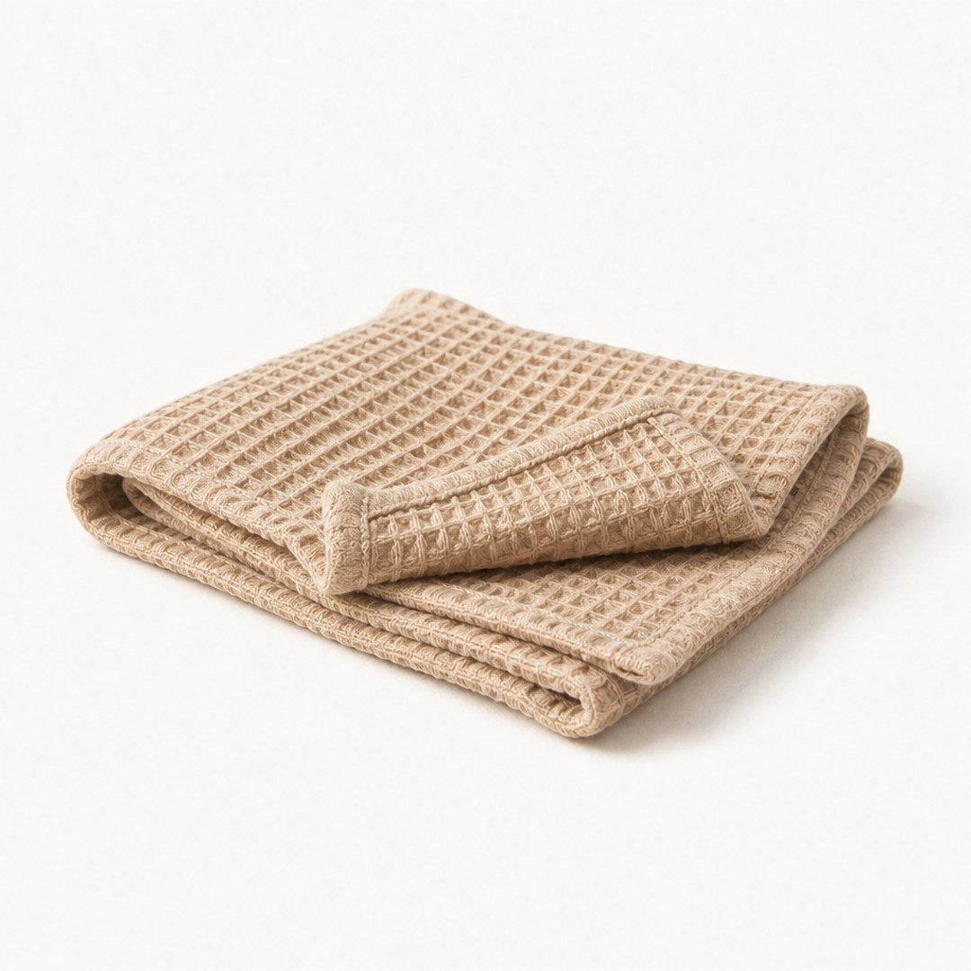 Waffle table runner with one end folded back showing hem and texture