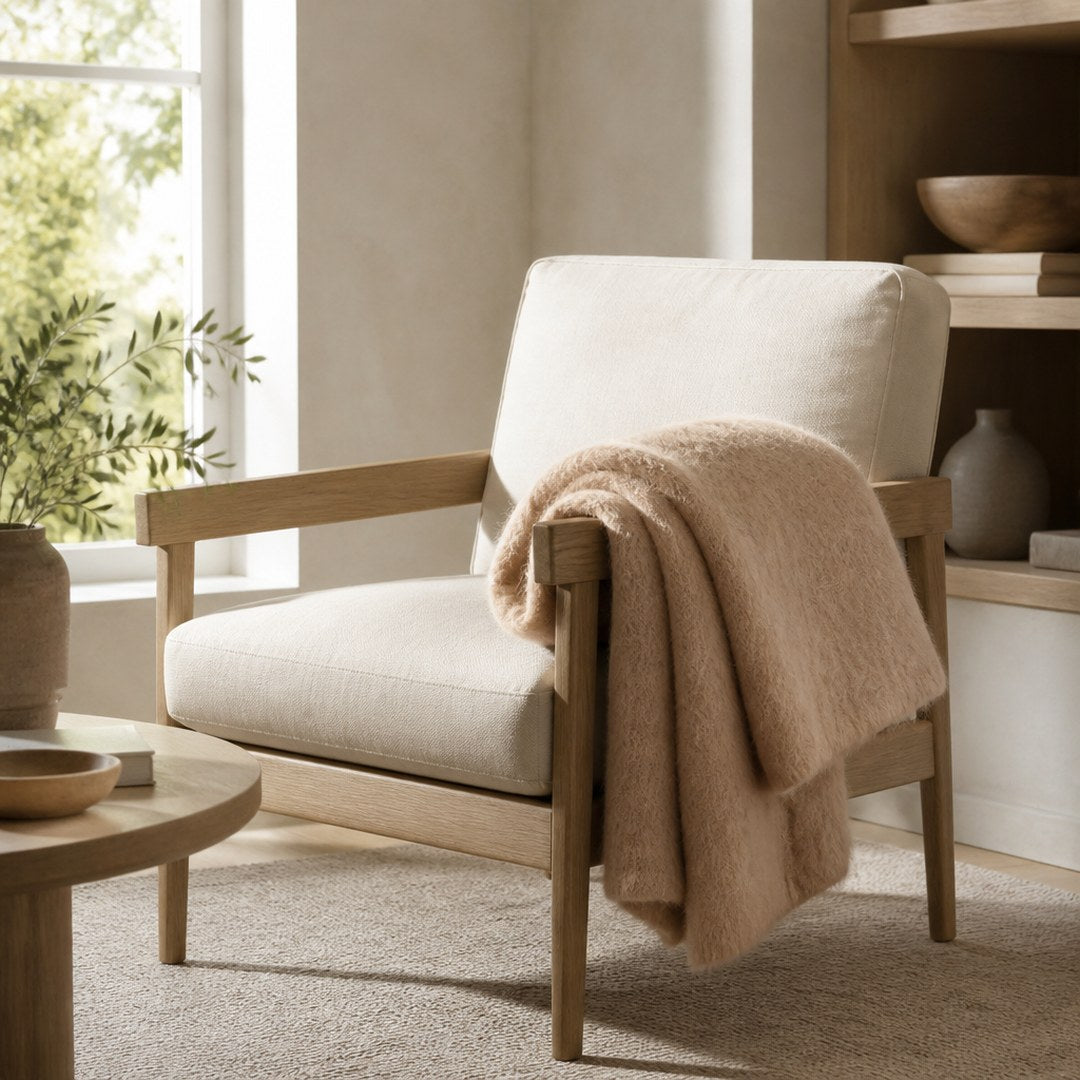 Mohair throw draped over an armchair beside a window