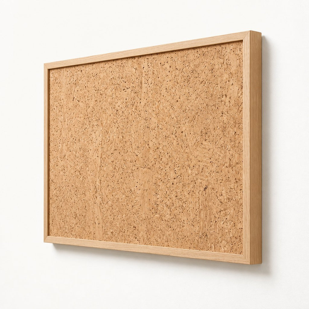 Oak frame pinboard at an angle showing the frame thickness and cork texture