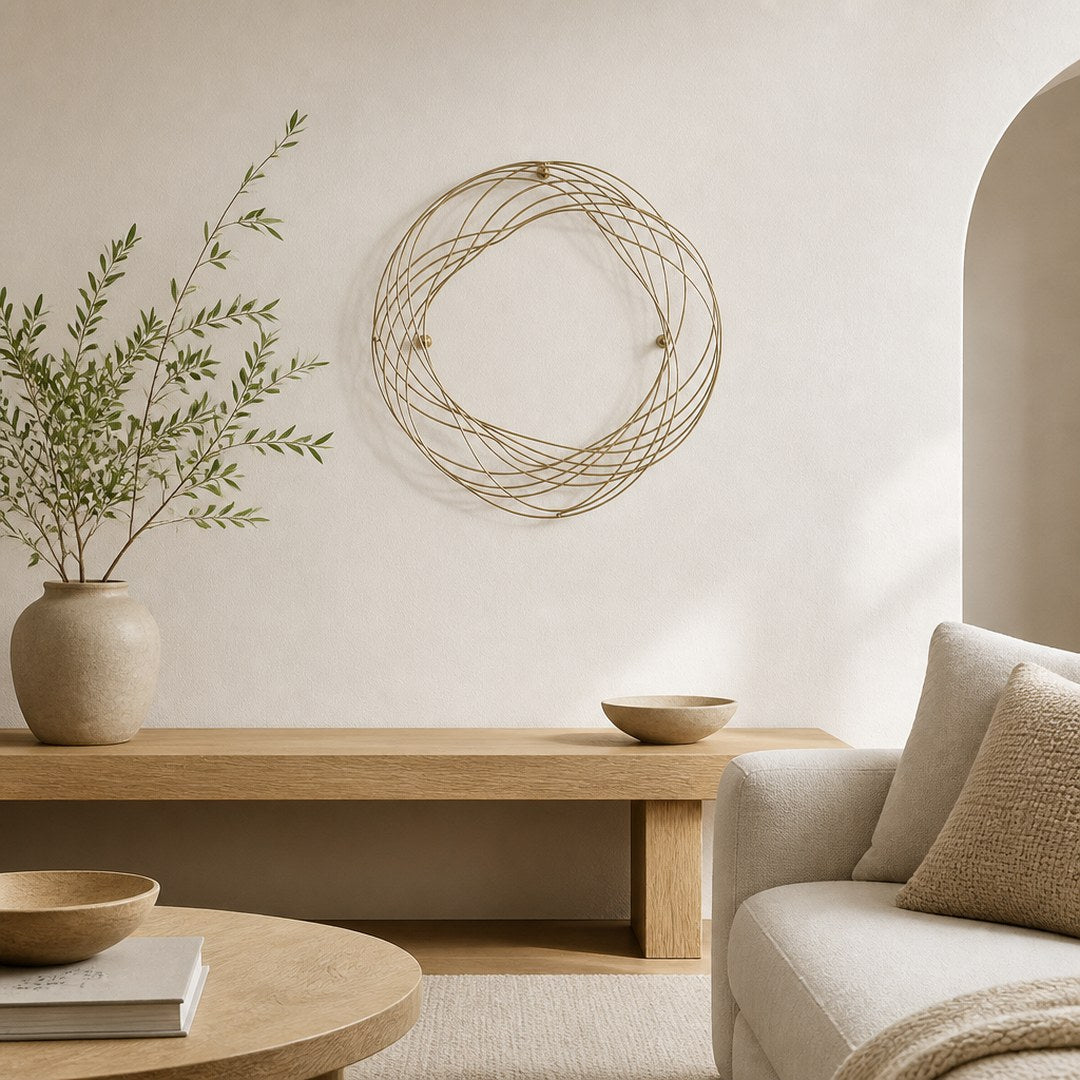 Wall sculpture mounted above a low bench in a living room