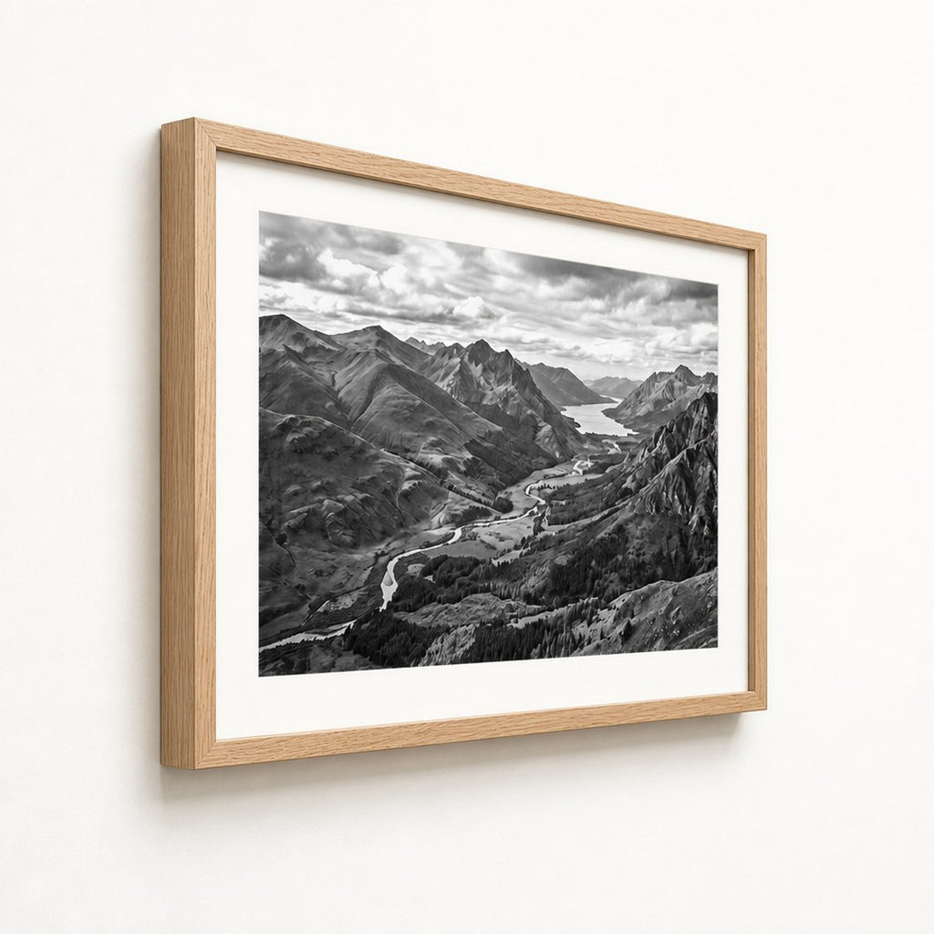 Framed landscape print at a three-quarter angle showing the frame depth and mat