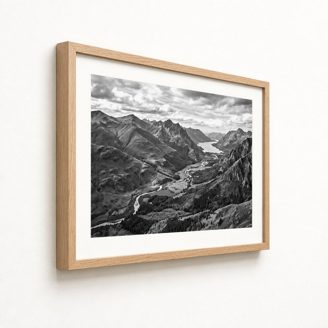 Framed landscape print at a three-quarter angle showing the frame depth and mat