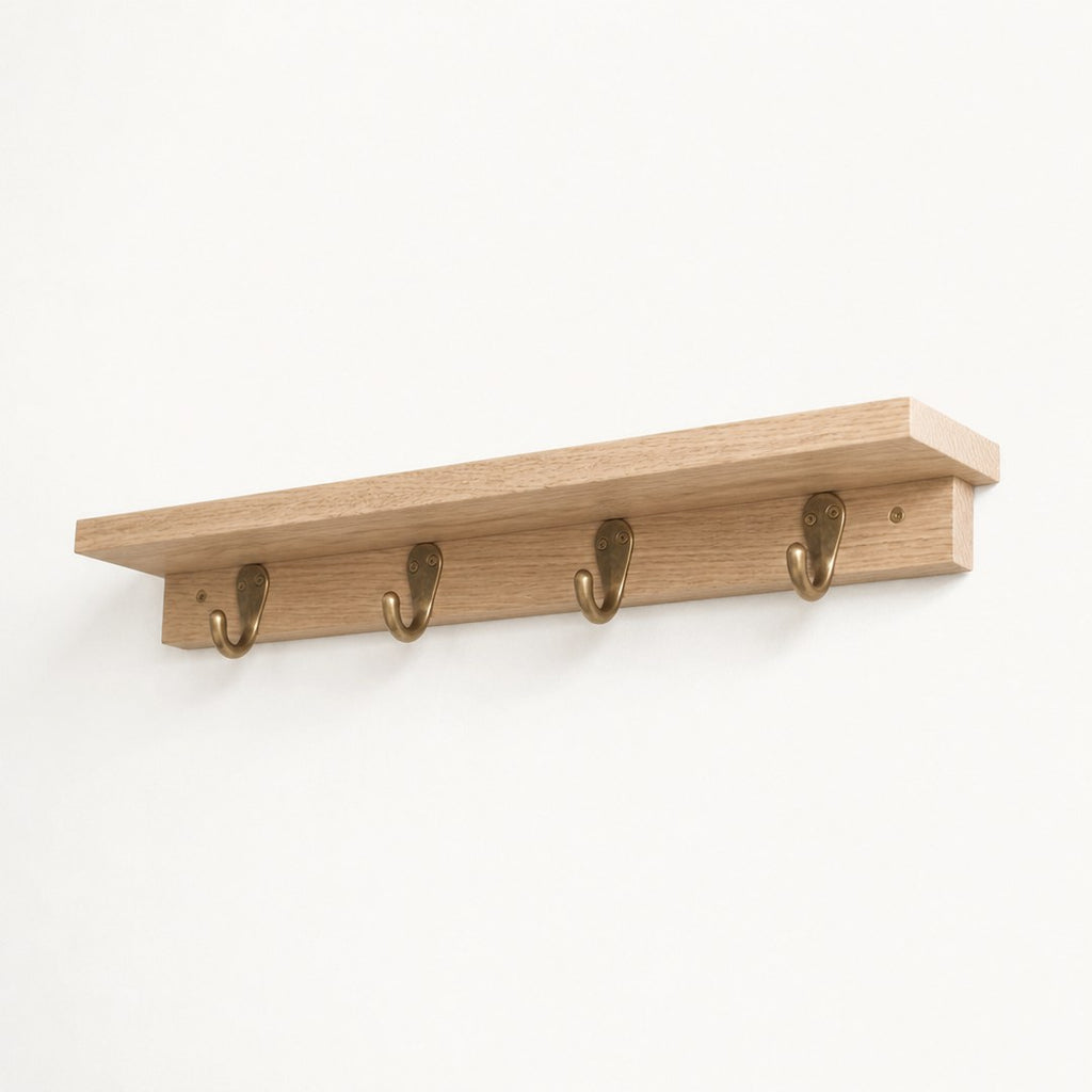Shelf with hooks seen from below showing the shelf underside and hooks