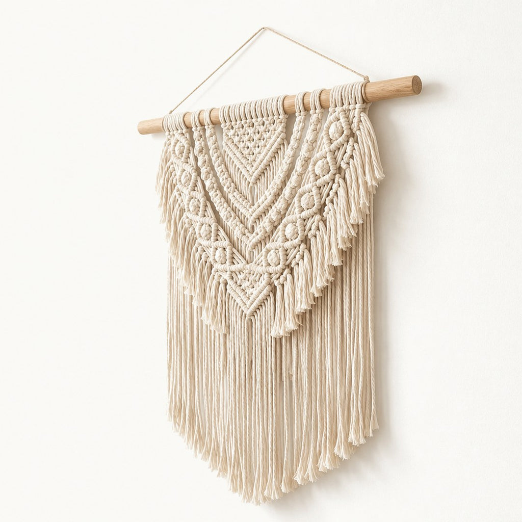 Woven wall hanging at a side angle showing weave depth and dowel ends